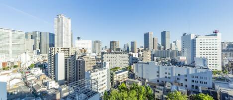 A cityscape with high-rise buildings, including a prominent Toyota sign.