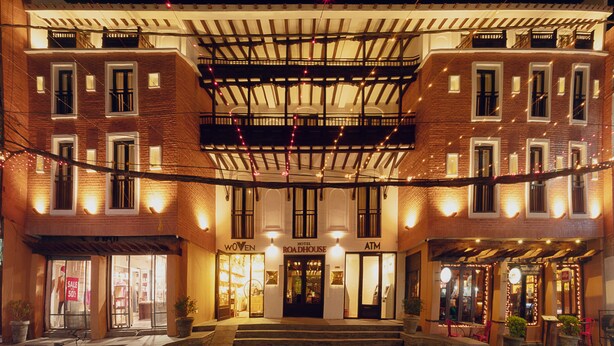 A hotel with a brick facade, a covered entrance, and outdoor seating. - Hotel Roadhouse, Thamel, Kathmandu- Contemporary Boutique (Kathmandu)