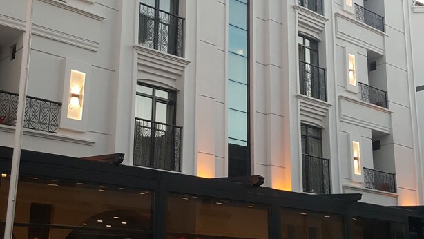 A hotel with a prominent sign reading "LIVIA-OTEL".