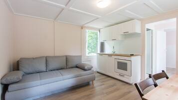 Bungalow, 1 Bedroom | Living area | Flat-screen TV, DVD player, ping pong