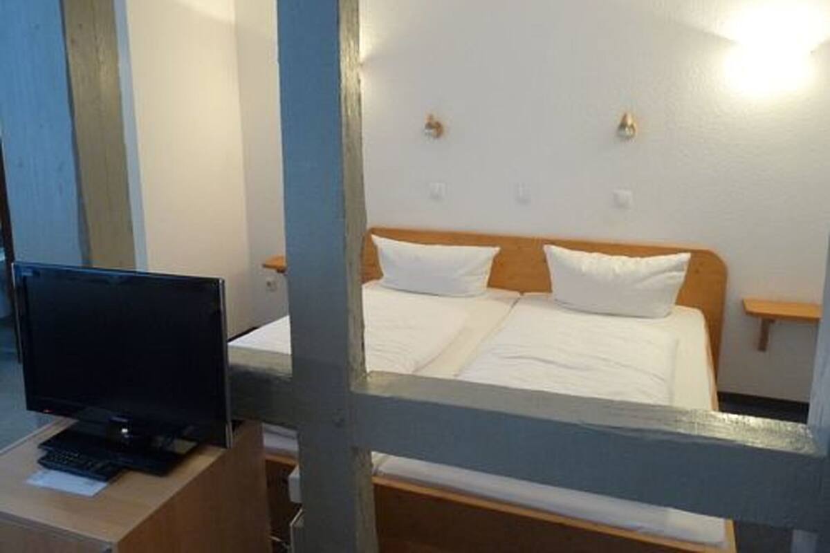Double Room | Minibar, desk, iron/ironing board, free cribs/infant beds