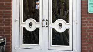 A double door entrance with a sign above stating "Hotel & Restaurant Landgasthaus Fischer". - Landgasthaus Fischer (Suthfeld)