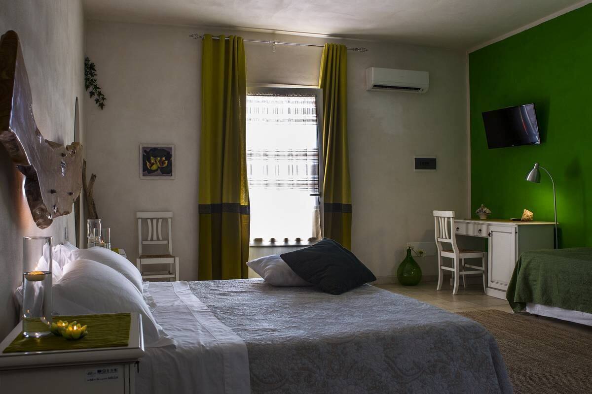 Quadruple Room, Garden View (Fichi) | Minibar, desk, cots/infant beds, bed sheets