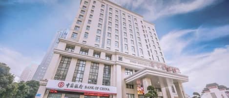 A multi-story building with a prominent sign for the Bank of China.