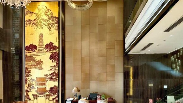 A lobby with a large traditional painting, a reception desk, and a staircase. - Jiangyin Furen Boutique Hotel (Zhongshan Park Subway Station) (Jiangyin)