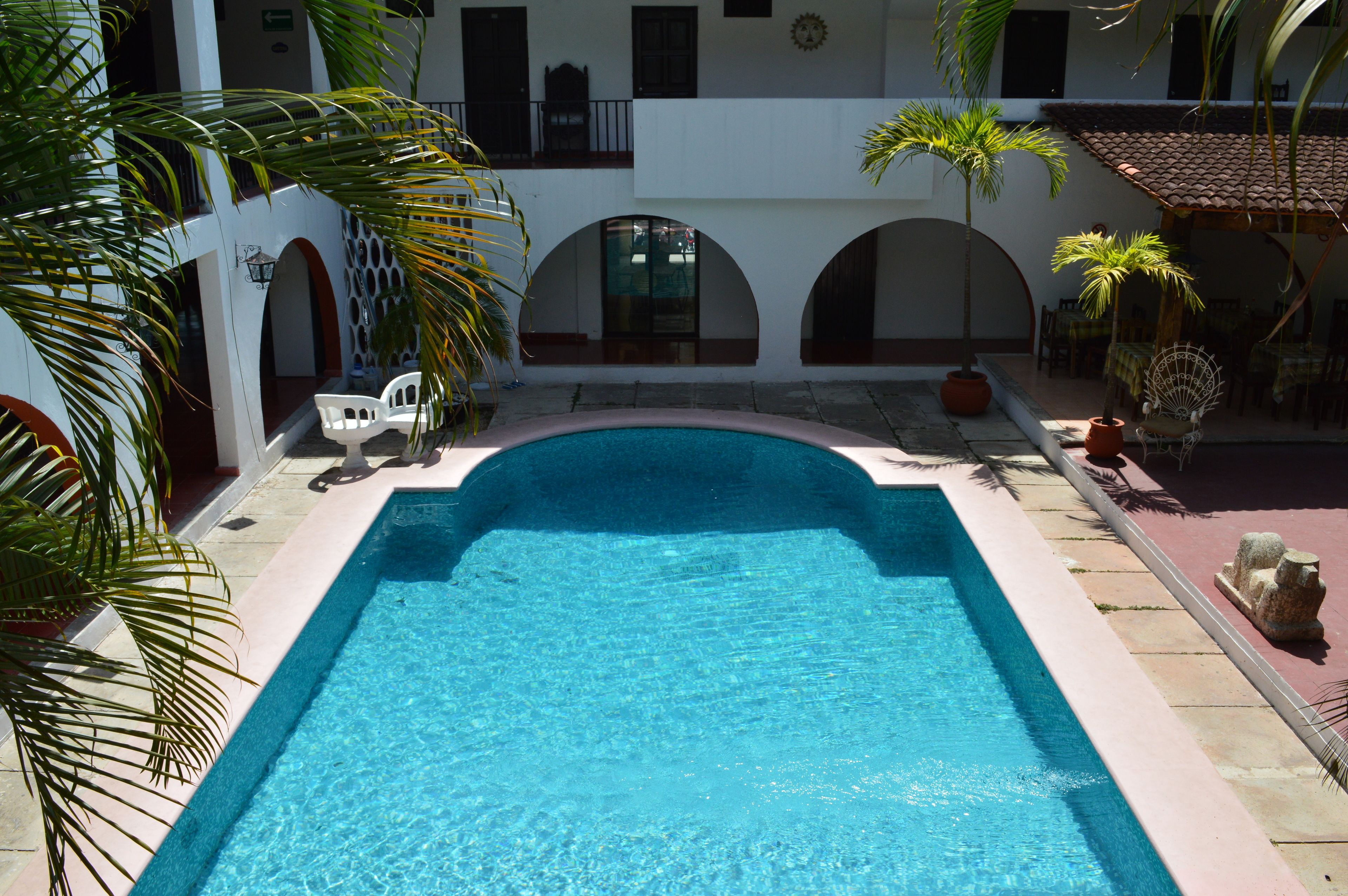 Outdoor pool, open 9 AM to 9 PM, pool loungers