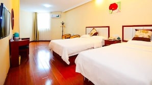 A hotel room with two beds, a TV, a desk, and a chair. - Greentree Inn (Xuzhou)