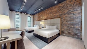 A modern hotel room with two beds, a desk, and a large window. - Studio 154 Luxury Hotel (Nashville)