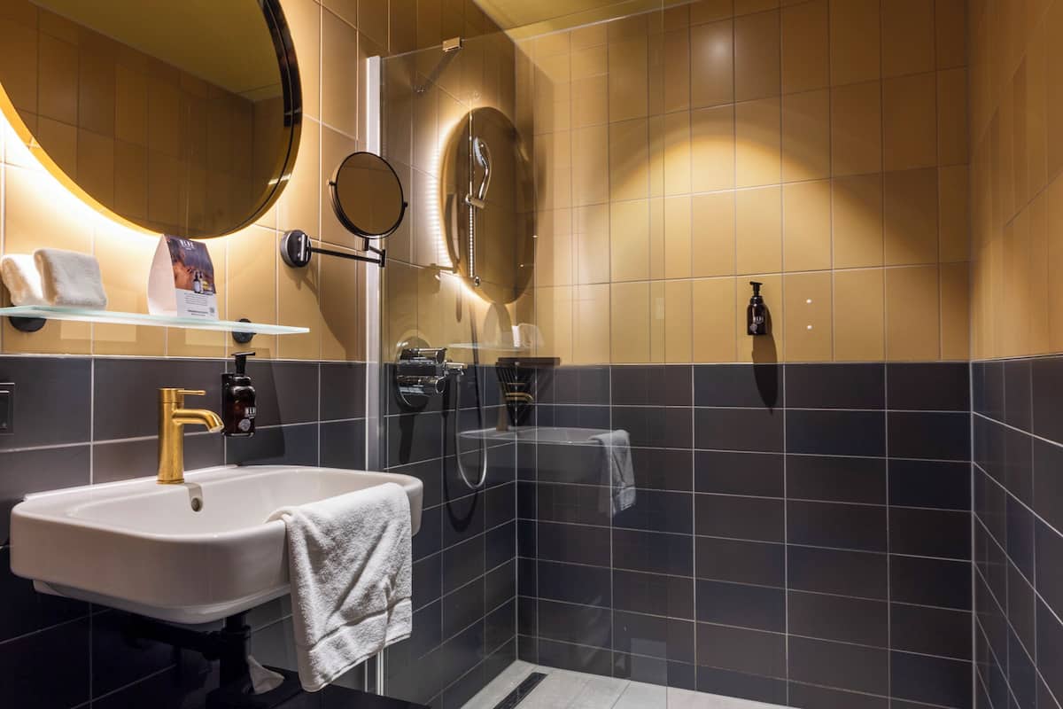 designer toiletries, hair dryer, bathrobes, heated floors