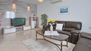 Appartement, uitzicht op zee | Woonruimte