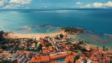 Enjoy the tranquil atmosphere of this coastal town with its picturesque beach and diverse architecture.