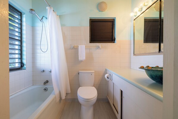 A bathroom with a bathtub, toilet, and sink. - Oceanfront - 3 Bedroom Villa - BEST VIEW IN TORTOLA (Long Bay)