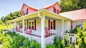 A two-story house with a porch, red shutters, and a white fence. - 42 acres with Dramatic Mtn. Views...Close to Appalachian Trail (Bakersville)