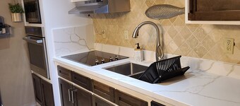 Relax In Our Luxurious Contemporary Beach Condo next to Clayton's Bar and Grill
