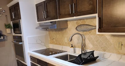 Relax In Our Luxurious Contemporary Beach Condo next to Clayton's Bar and Grill