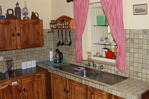 Full-sized fridge, microwave, stovetop, dishwasher