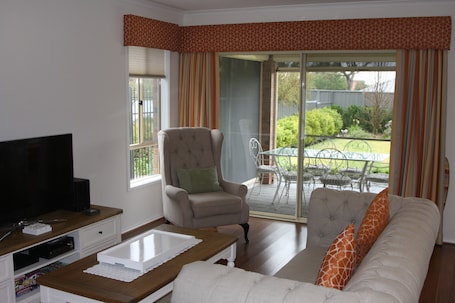Premium Cottage, 3 Bedrooms, Garden View | Living area | Flat-screen TV, DVD player