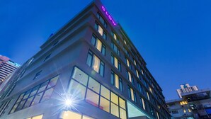 A modern building with a prominent 'CLOU' sign on the top. - GLOW Sukhumvit 5 by Centropolis (Bangkok)