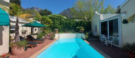 Seasonal outdoor pool, pool umbrellas, sun loungers