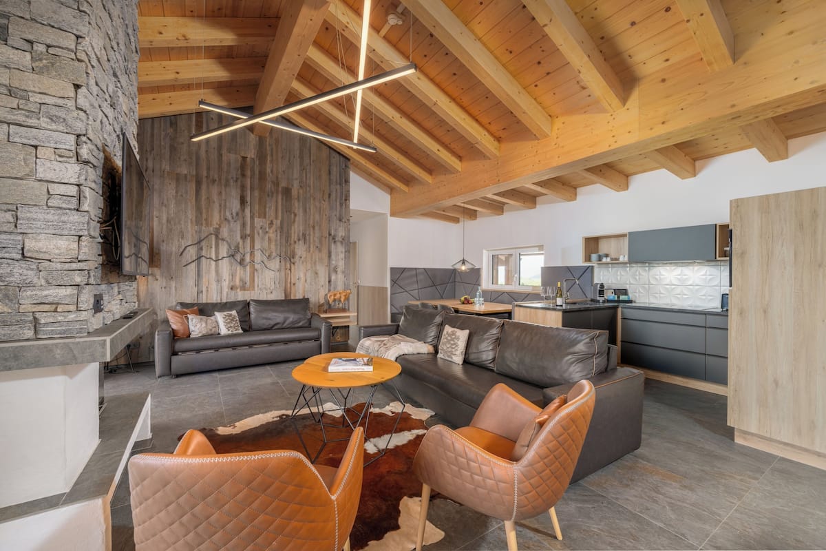 deluxe penthouse, 3 bedrooms | living area | flat-screen tv