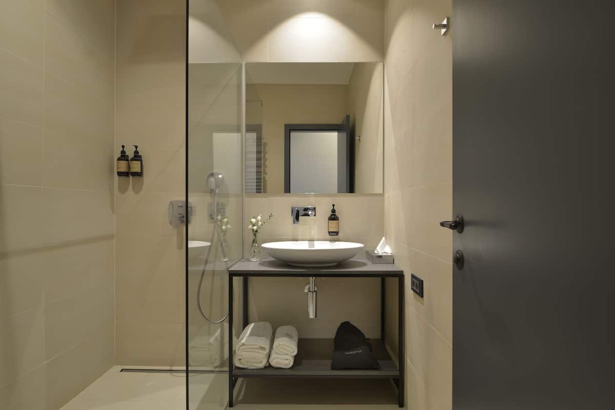 shower, rainfall showerhead, hair dryer, towels