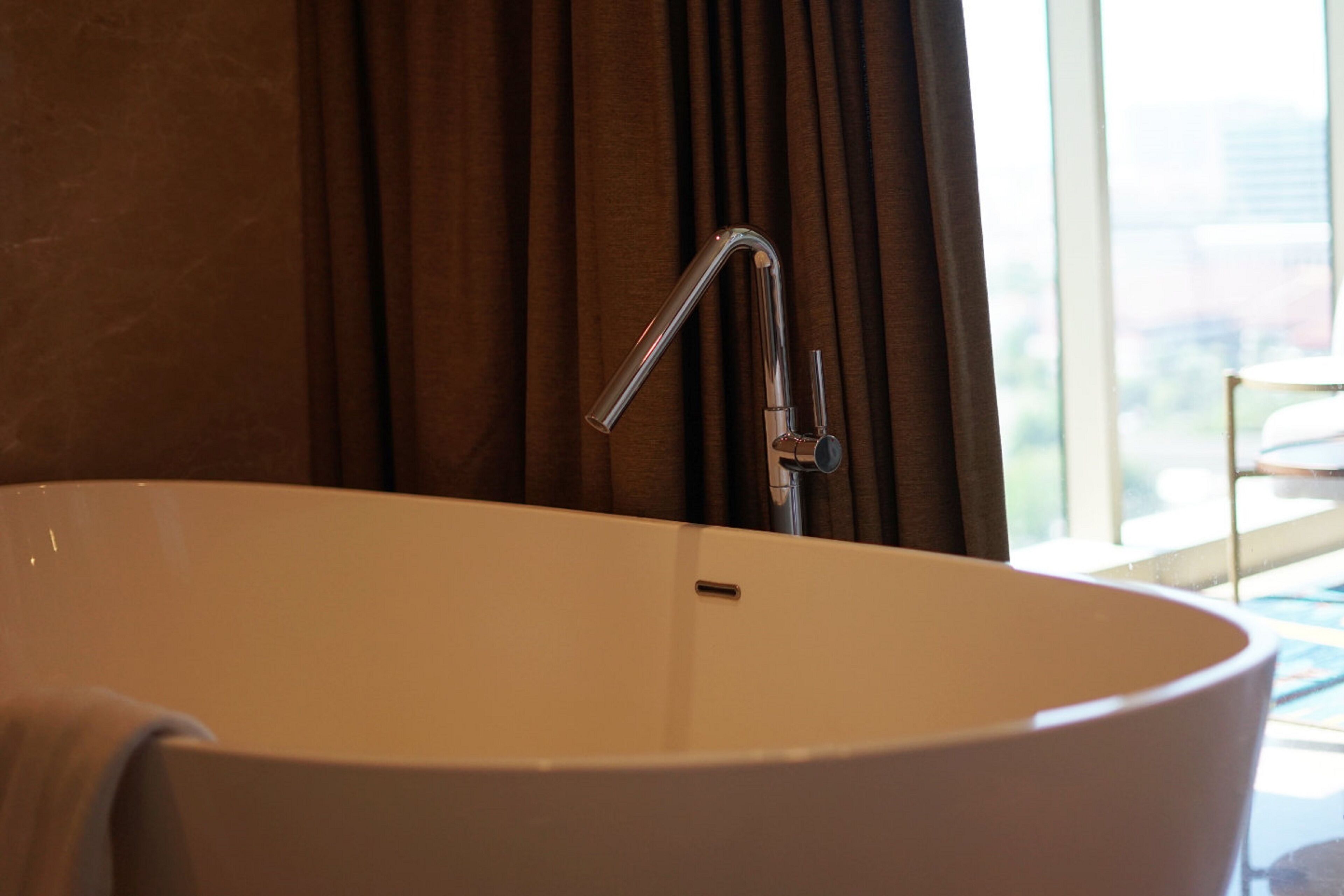 junior suite king bed, non smoking | bathroom | shower, free toiletries, slippers, towels