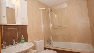 Shower, hair dryer, towels, toilet paper