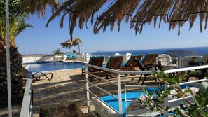 Outdoor pool, pool umbrellas, pool loungers