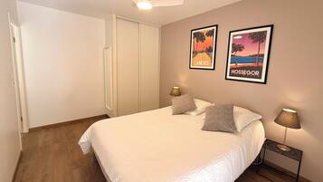 1 bedroom, desk, iron/ironing board, travel crib