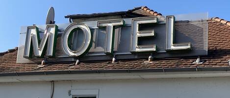 A motel sign with the word "MOTEL" in large letters.
