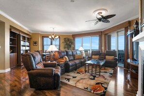 TV, fireplace, DVD player, books - Ocean Vistas 1101 Penthouse 3 BD 3.5 Bth, 3 Balconies, & Ocean Front Views! (Daytona Beach)