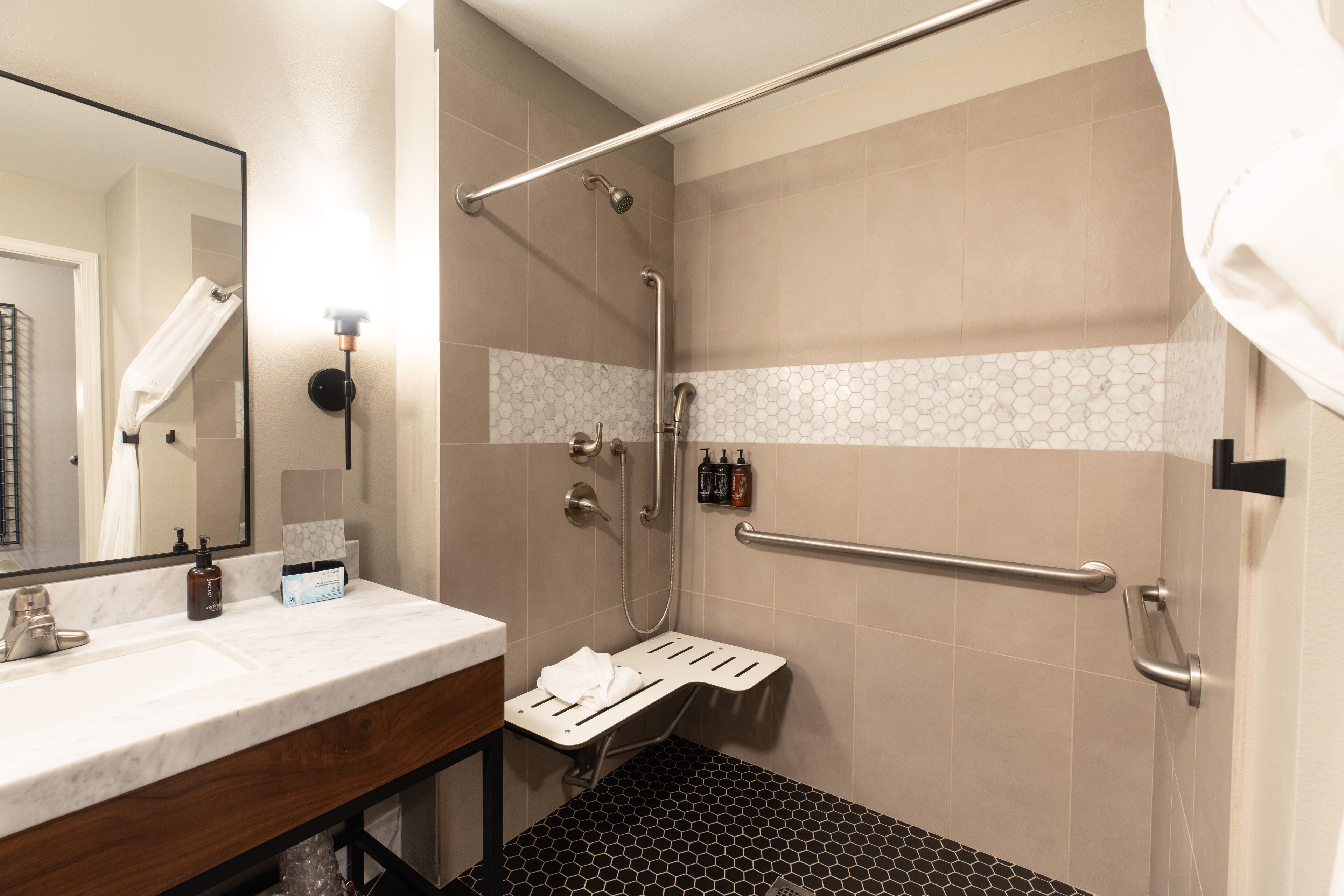 2 queen suite roll-in shower | bathroom | free toiletries, hair dryer, towels, soap