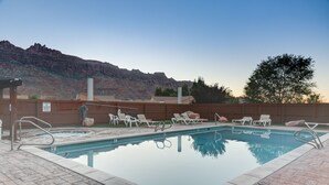 A swimming pool with lounge chairs, a hot tub, and a view of a mountain range. - Mountain Views In the heart Of Canyon Country; Adventure base for your visit! (Moab)