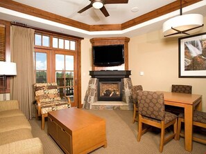 Flat-screen TV, fireplace, DVD player, computer monitors