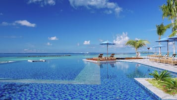 Outdoor pool, pool umbrellas, sun loungers
