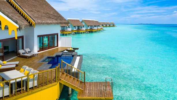 Overwater bungalows with a pool, wooden deck, and thatched roofs. - SAii Lagoon Maldives, Curio Collection by Hilton (Eh'mafushi)