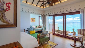 Overwater Villa | Living area | 42-inch LCD TV with cable channels, TV, streaming services
