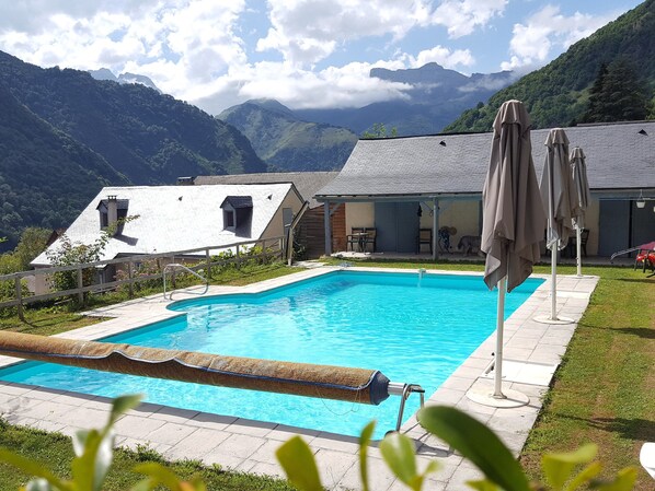 Seasonal outdoor pool, open noon to 8 PM, pool umbrellas