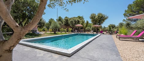 Seasonal outdoor pool, open 8 AM to 10 PM, pool umbrellas, pool loungers