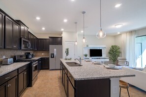Fresh Life | Private kitchen | Fridge, microwave, oven, stovetop - Davenport Homes in Solterra Rst by ADR (Davenport)
