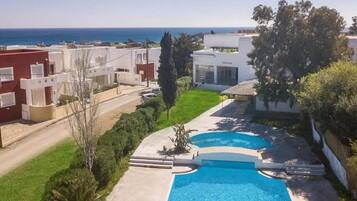 Outdoor pool, pool umbrellas, pool loungers