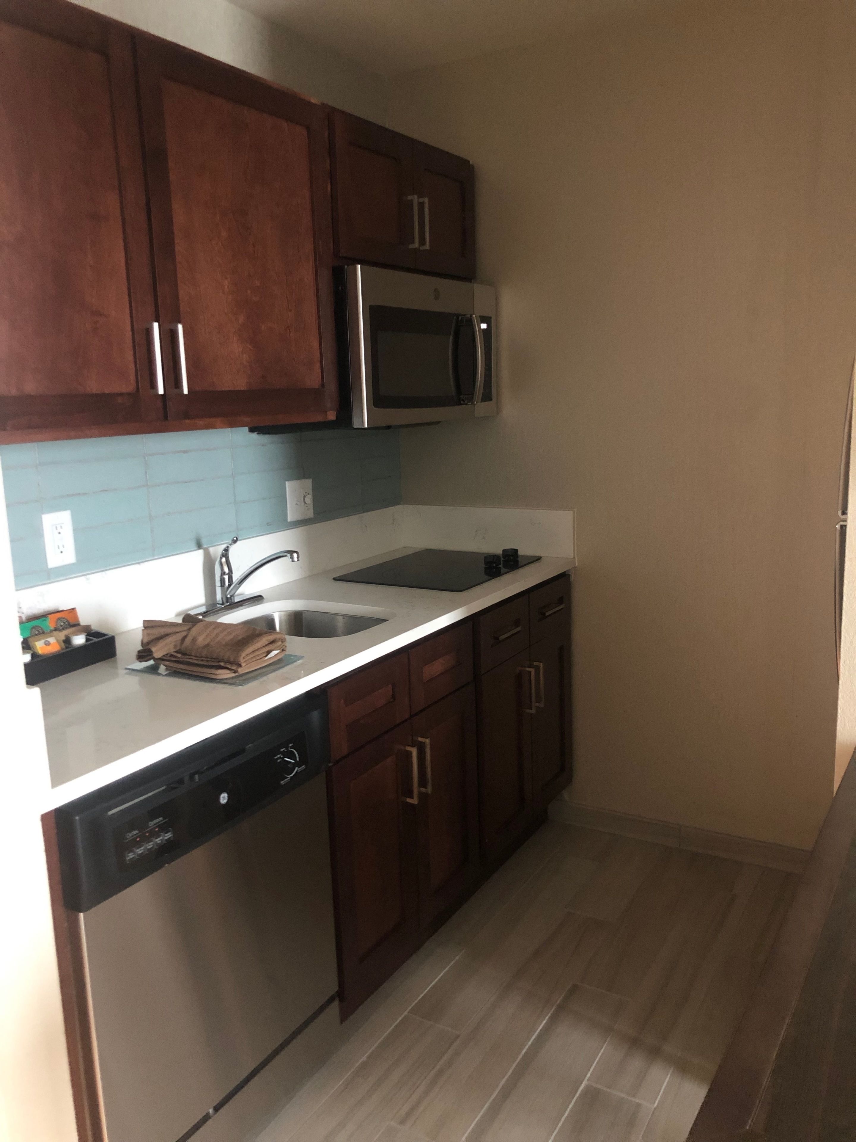 full-sized fridge, microwave, coffee/tea maker, cookware/dishes/utensils