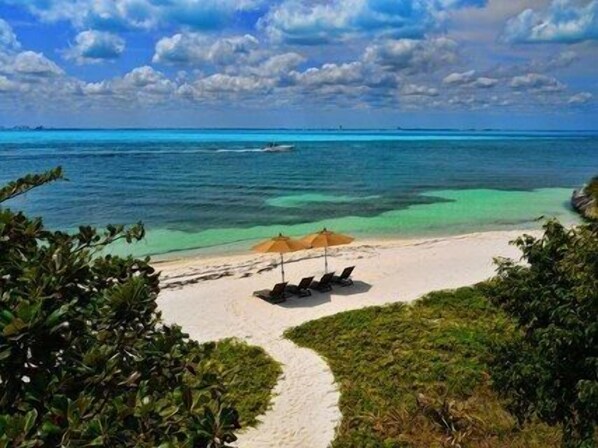 On the beach, sun loungers, beach towels