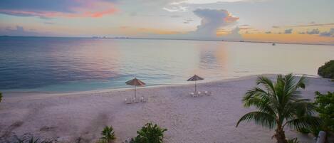 On the beach, sun loungers, beach towels