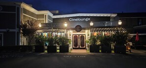 A CineLounge building with a marquee sign, a clock, and a fire lane marking on the pavement. - Luxury 2BR with Pool & Panoramic Golden Gate  and Skyline Views (Tiburon)