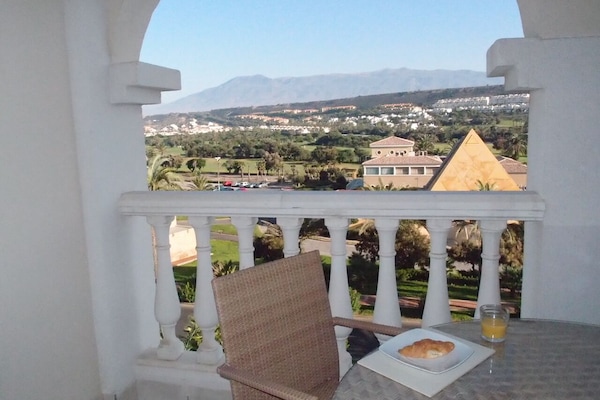 View of Almerimar golf course club house and surrounding mountains