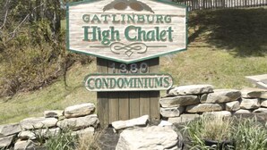 A wooden sign for Gatlinburg High Chalet condominiums, indicating 1380 units. - "AMAZING" LONG RANGE MOUNTAIN VEIWS!! Peaceful MountainTop Getaway! (Gatlinburg)