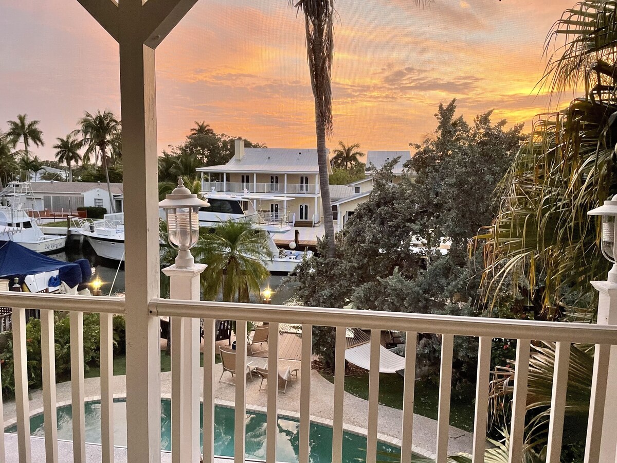 Luxury WATERFRONT Estate! Golfcart, STEAM SHOWER, heat pool, steps to the beach!