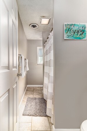 Bathtub, hair dryer, towels