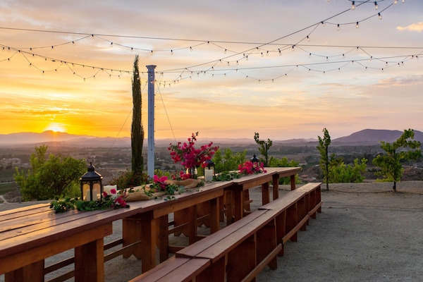 Vineyard dining area overlooking 
Temecula valley and wine-country.